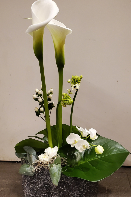 Blumengesteck-Loewen-Grosshoechstetten.png